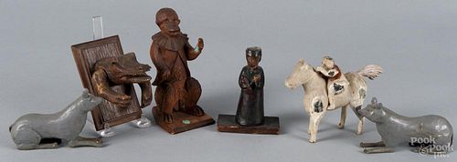 Assorted carved figures, to include a painted pair of dogs, an organ grinder's monkey, a gesso figure