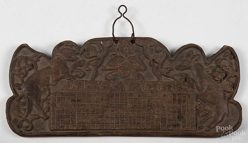 Carved wood calendar, 18th/19th c., 7 1/2'' x 17 1/4''. Provenance: DeHoogh Gallery, Philadelphia.