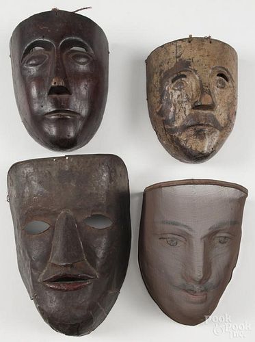 Four masks, 19th c., to include carved wood, mesh, and metal examples. Provenance: DeHoogh Gallery