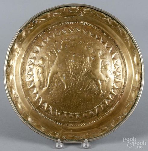 Continental punchwork brass alms dish, engraved with a harvest scene, 17th/18th c., 12'' dia.