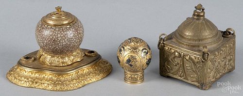 French ormolu mounted inkwell, 19th c., 3 3/4'' h., together with an Eastern brass inkwell, 3 1/2'' h.