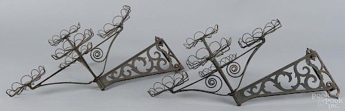 Pair of American cast iron painted wall sconces, 19th c., with swinging arms, 14'' h., 21 1/2'' w.