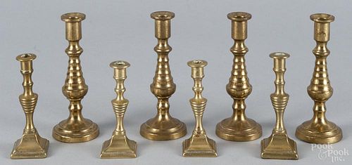 Set of four English miniature brass candlesticks, 19th c., 5'' h.