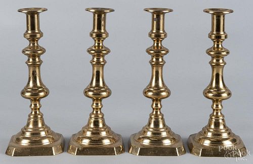Set of four English brass candlesticks, 19th c., 11'' h. Provenance: DeHoogh Gallery, Philadelphia.