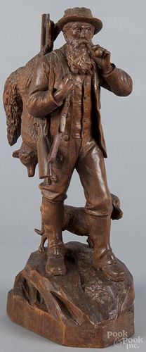 Continental carved figure of a hunter, 19th c., with a fox and dog, 17'' h.