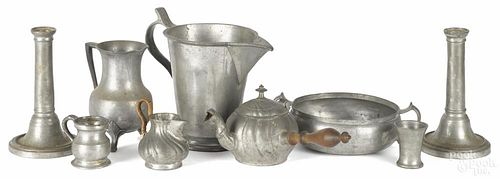 Nine pieces of assorted European pewter tablewares, late 18th/19th c., to include measures