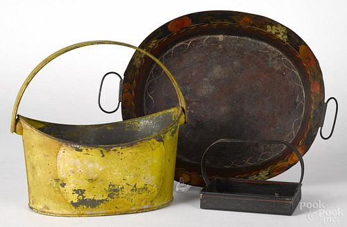 Three pieces of Continental tole painted tinware, 19th c., to include a tray, 4'' h., a basket, 11'' h.