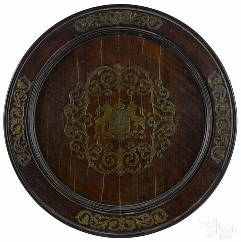 Brass inlaid walnut panel, ca. 1900, with a family crest, 19 1/2'' dia.