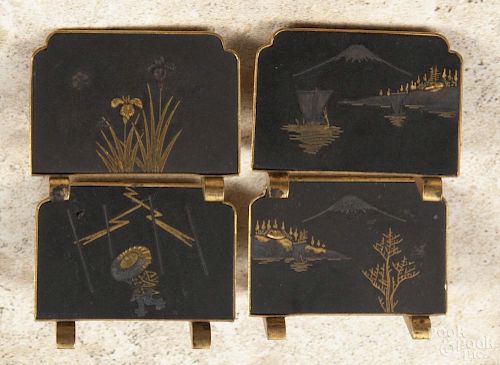 Set of four Japanese komai style place card stands, 20th c., with shakudo and gilt scenes, 1 1/4'' h.