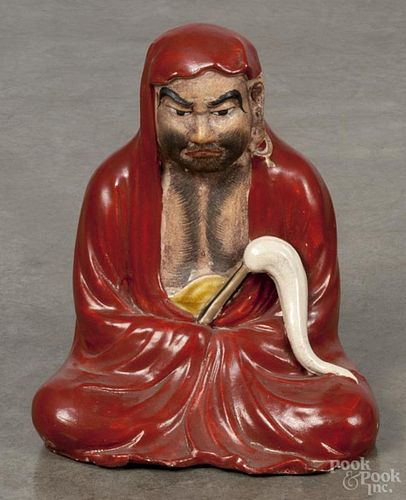 Chinese porcelain seated Bodhidharma figure with hand-painted features, 9'' h.