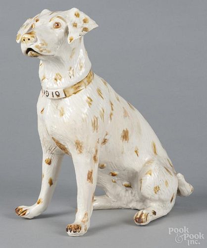 Porcelain spaniel, probably French, the collar inscribed 1910, 12'' h. Provenance: DeHoogh Gallery
