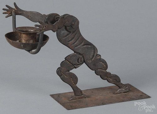 German iron figural candleholder, early 20th c., marked behind rear foot, 6 1/4" h.