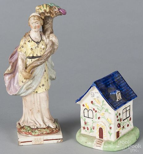 Early Staffordshire figure of a woman with a cornucopia, 18th c., 10 1/2'' h.