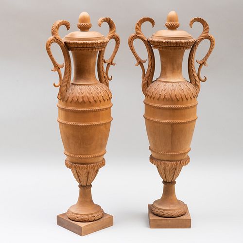 Pair of Continental Classical Limewood Vases and Covers