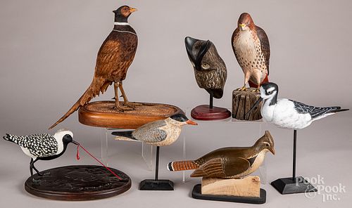 Seven assorted carved and painted birds