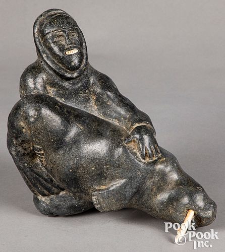 Large Inuit carved soapstone hunter with walrus