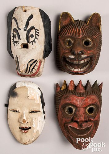 Group of four ethnographic masks