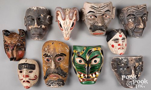 Ten carved and painted Mexican masks