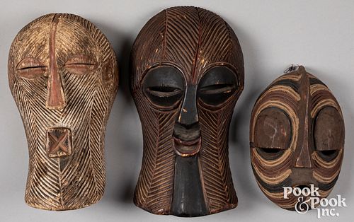 Three African Songye carved wood masks