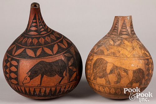 Two African decorated gourd bottle