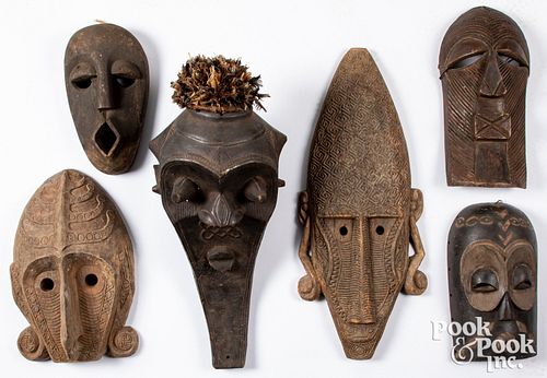 Six wood carved African tribal masks
