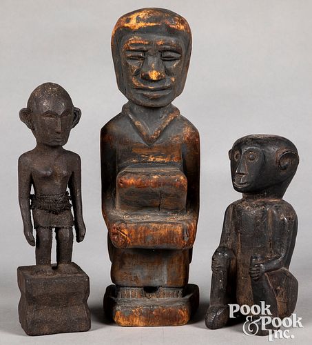 Three carved tribal statues