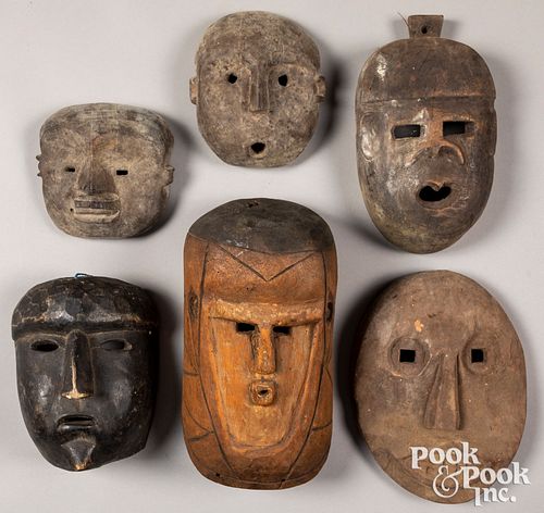 Six carved tribal masks