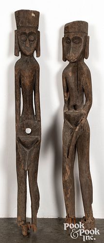Pair of Indonesian carved wood statue presses