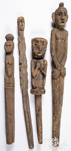 Four Timor carved wood statues