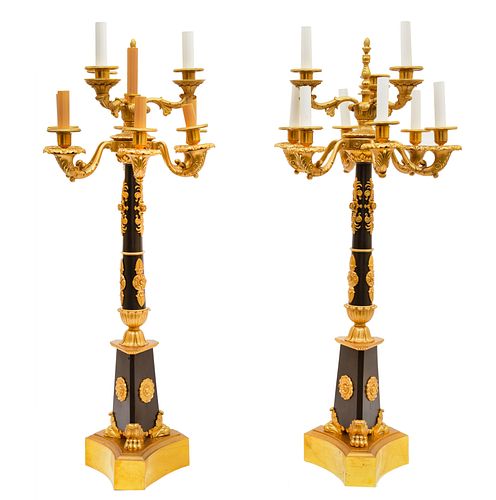 PAIR OF FRENCH EMPIRE GILT-BRONZE AND EBONISED SEVER-LIGHT TORCHIERES