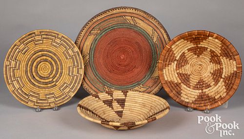Four coiled tribal baskets