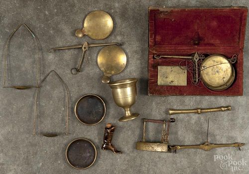 Two brass gold scales, 19th c., together with a miniature brass mortar and pestle, a sad iron