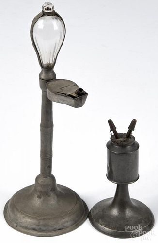Pewter oil lamp clock, 19th c., 14 1/4'' h., together with a pewter whale oil lamp, 7 1/4'' h.