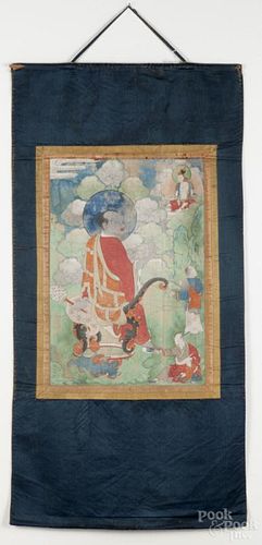 Early Southeast Asian oil on linen wall hanging on a silk ground, likely Tibetan, 53'' x 27 1/2''.