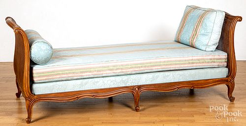 Mahogany and rattan daybed, with silk upholstery