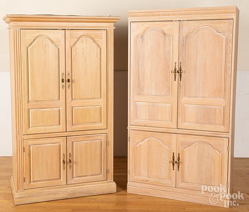 Two oak entertainment cabinets, 76 1/4" h., 41" w