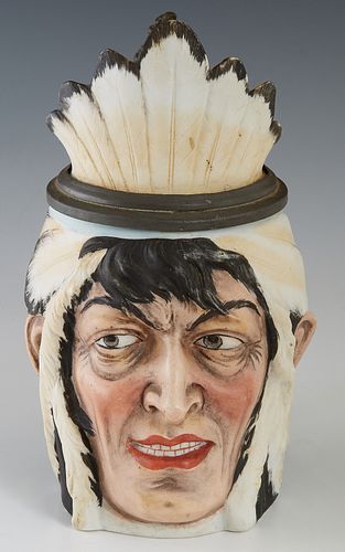 Ernst Bohne Native American Porcelain Character Stein, c. 1900, 1/2 Liter, in a feather headdress, H.- 7 1/2 in., W.- 4 1/4 in., D.- 5 3/4 in.