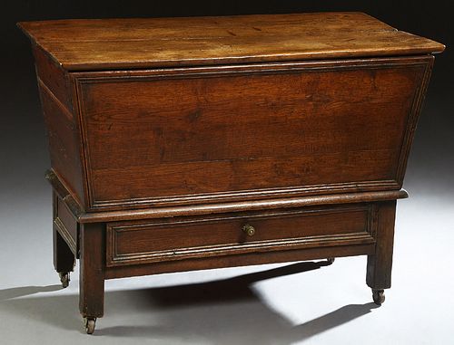 French Provincial Carved Oak Petrin, 19th c., the hinged top over a cloth lined interior, over a lower drawer, on block feet, H.- 30 1/2 in., W.- 41 3