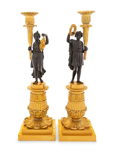 A Pair of Charles X Style Gilt and Patinated Bronze Figural Candlesticks