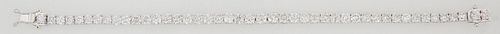 18K White Gold Tennis Bracelet, each of the 45 links with a graduated round diamond, ranging from 3.8-4 mm, total diamond wt.- 12.19 cts., L.- 7 3/4 i