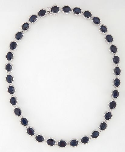 14K White Gold Link Necklace, each of the 34 links with an oval blue sapphire atop a border of round diamonds, total sapphire wt.-75.32 cts., total di