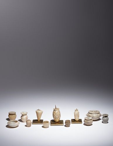 Twelve Egyptian Alabaster, Breccia and Other Stone Vessels
Height of tallest example 2 5/8 inches.