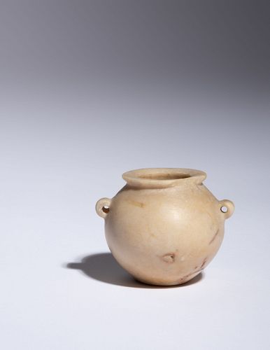 An Egyptian Miniature Twin-Handled Calcite Jar
Height 1 5/8 inches.