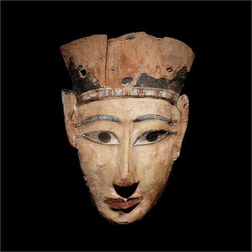 An Egyptian Painted Wood Mummy Mask
Height 12 x width 8 1/8 inches.
