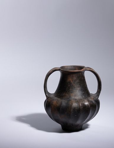 An Etruscan Bucchero Amphora
Height 6 7/8 inches.