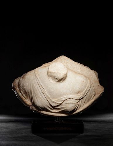 A Roman Marble Draped Aphrodite from a Roundel
Height 11 1/4 x width 16 3/4 inches.