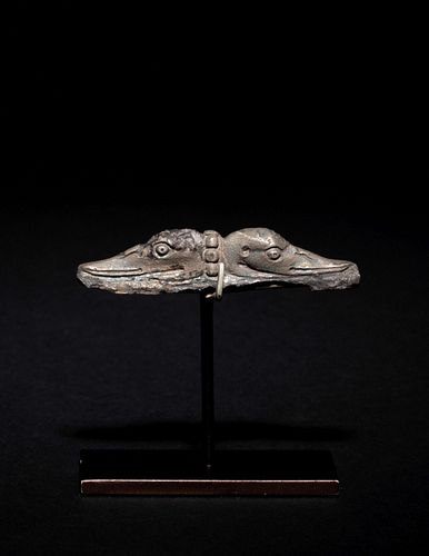 A Roman Silver Ornament Formed as Two Duck Heads
Length 2 1/4 inches.