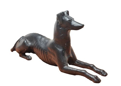 A pair of 19th century cast iron lawn or garden ornaments, in the form of a recumbent whippet dog, late 19th century, possibly J.W. Fiske Foundry of N