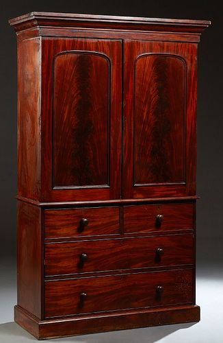 English Carved Mahogany Linen Press, 19th c, the ogee crown over double arched panel doors, enclosing four sliding drawers, on a base with two deep fr
