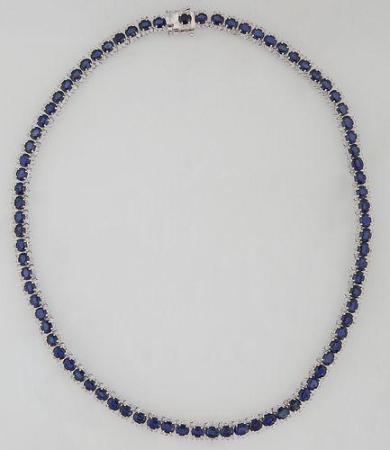 14K White Gold Link Necklace, each of the 82 links with an oval sapphire, bordered on two sides by 3 diamond points, total sapphire wt.- 42.2 cts., to